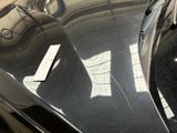a reflection of a car on the hood of a car