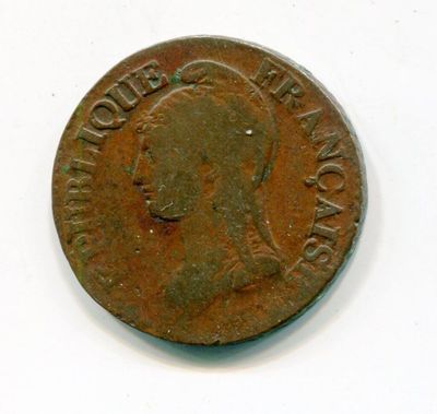 a close up of a coin on a white surface with a white background
