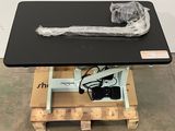 a black table with a plastic bag on top of it