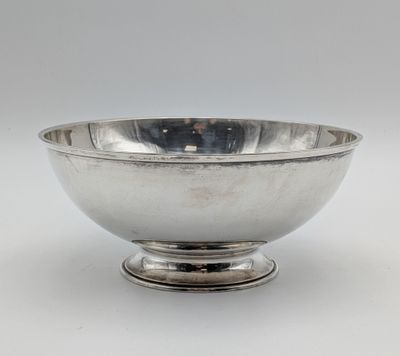 silver plated bowl on pedestal on white background with white background