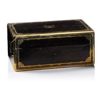 a black and gold box on a white surface