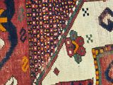 a close up of a rug with an elephant on it