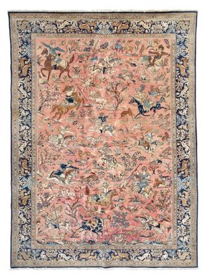 an antique persian rug with birds and flowers on a pink ground