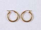 a pair of gold hoop earrings on a white background