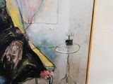 un tableau représentant une femme assise sur une chaise à côté d'un verre de vin