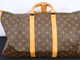a louis vuittoupe bag on a black surface