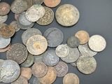 a lot of coins that are on the table