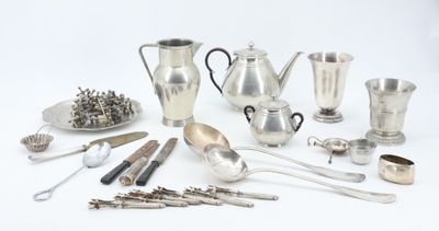 many different types of silverware on the table
