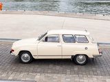 a small white car that is parked on the side of the road