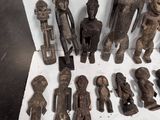 a lot of wooden figurines sitting on a table