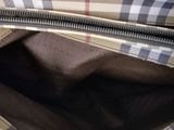 the inside of a burber bag with a zipper open