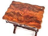 a small table with a wooden top on a white background