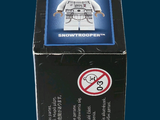 a box with a lego figure in it on a blue background