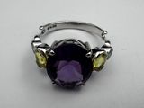 an amethorate and citrine ring on a white surface