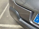 a close up of a car ' s license plate on the front of a car