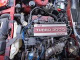 a picture of a car engine with its hood open