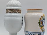 two vases sitting next to each other on a table