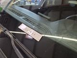 a sticker on the windshield of a car with a sticker attached to it