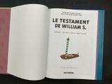 an open book with a picture of a candle on it