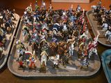 a lot of figurines that are sitting on a table