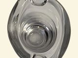 a clear glass vase with a circular design on it