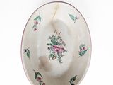 a white bowl with a floral design on it