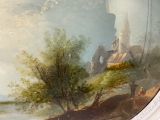 a painting on the wall of a building by the water