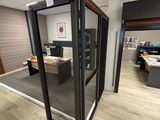 an image of an office cubicle with a glass door