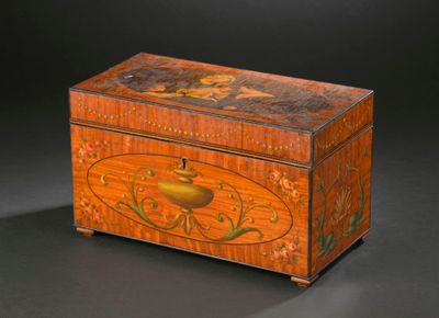 a small wooden box with a painting on it