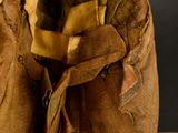 a small brown bag with a hole in it sitting on a table