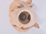 overhead view of a ceramic sculpture of a cat ' s head with a cat ' s eye