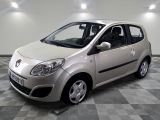 a picture of a small silver car parked in a garage
