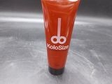 a tube of toothpaste sitting on a metal surface