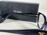 prada eyeglasses in a black box and a pair of glasses