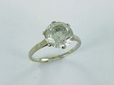 an image of a diamond ring on a white surface