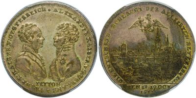 a gold coin with an image of a man and a woman on it