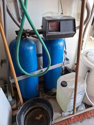 a picture of a room with a lot of water tanks and a hose