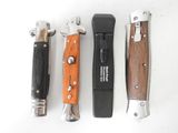 four different types of knives are lined up on a white surface