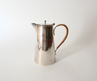 an image of a silver coffee pot on a white surface