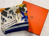 an orange box with a blue bird on it and a white and orange box with a blue bird on it