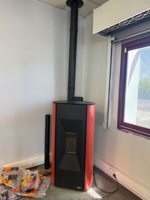 a wood burning stove in the corner of a room