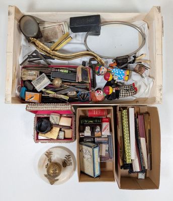 a wooden box filled with assorted items on a table