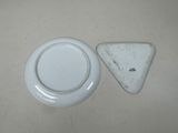 a white plate with a triangle on it next to a white plate