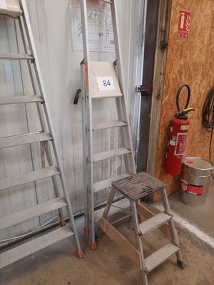 two ladders next to each other in a garage