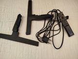 two remote controls and a remote control on a bed