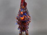 glass figurine of a rooster on a clear base