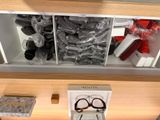 a display case with glasses and other items on it