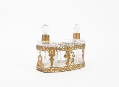 an image of a glass candle holder with two candles on top of it