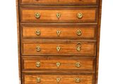 an antique chest of drawers with marble top