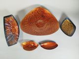 several pieces of art that are sitting on a table